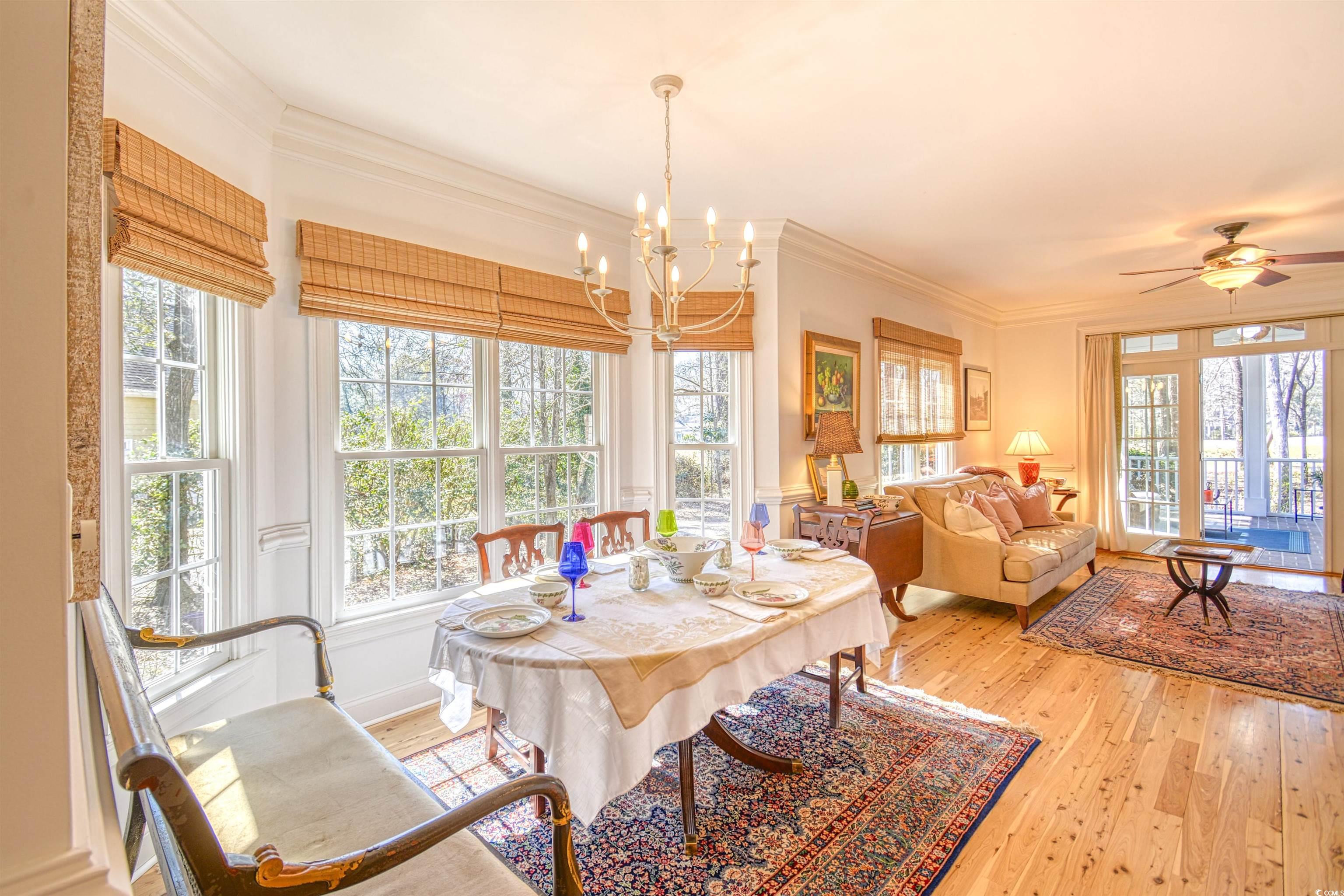 4514 Wagon Run Murrells Inlet, SC 29576 - Photo 6 of 40 Dining area featuring crown molding, light wood fi