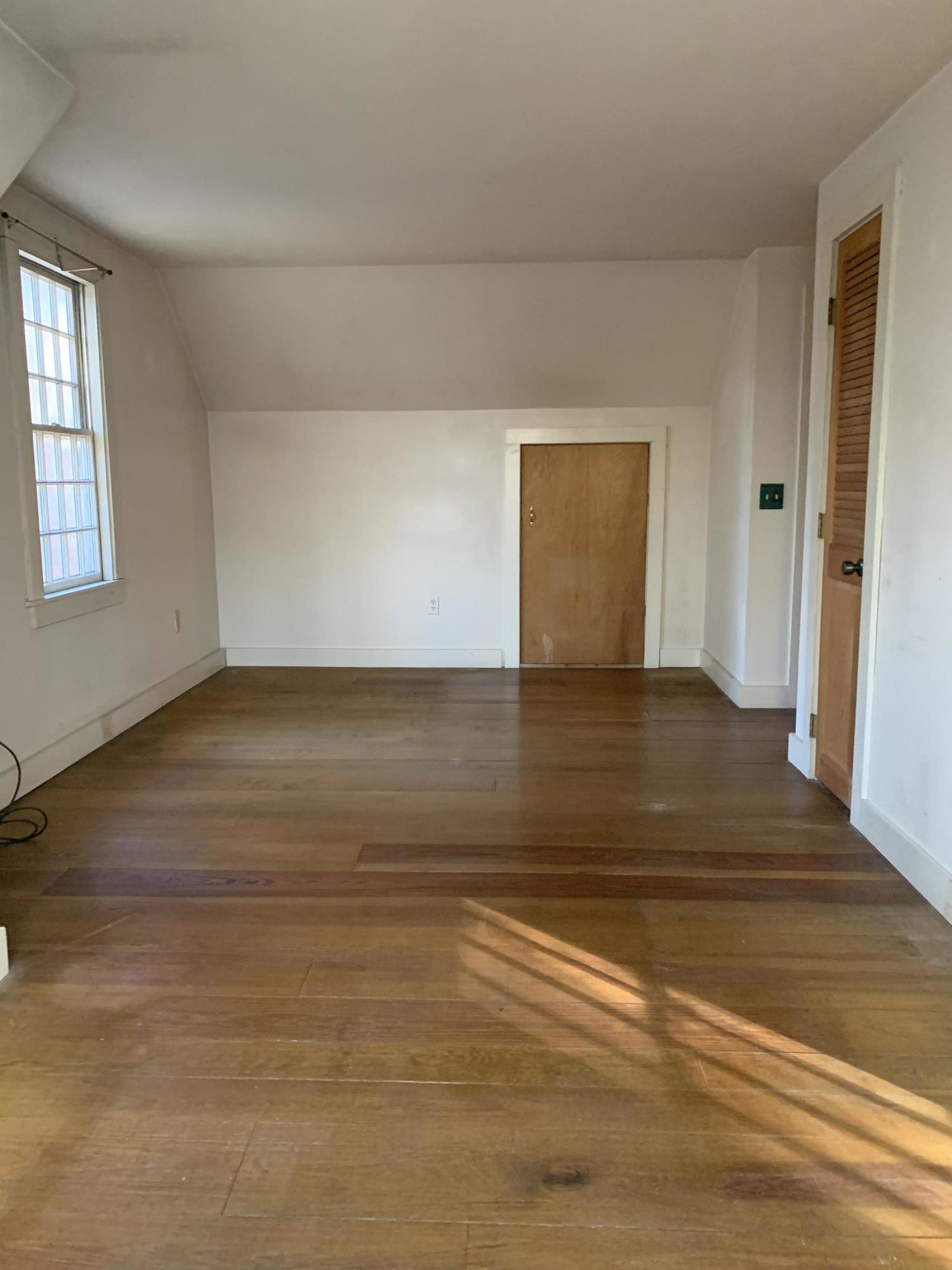 150 Browns Neck Road Wellfleet, MA 02667 - Photo 25 of 30 a view of empty room with wooden floor and fan