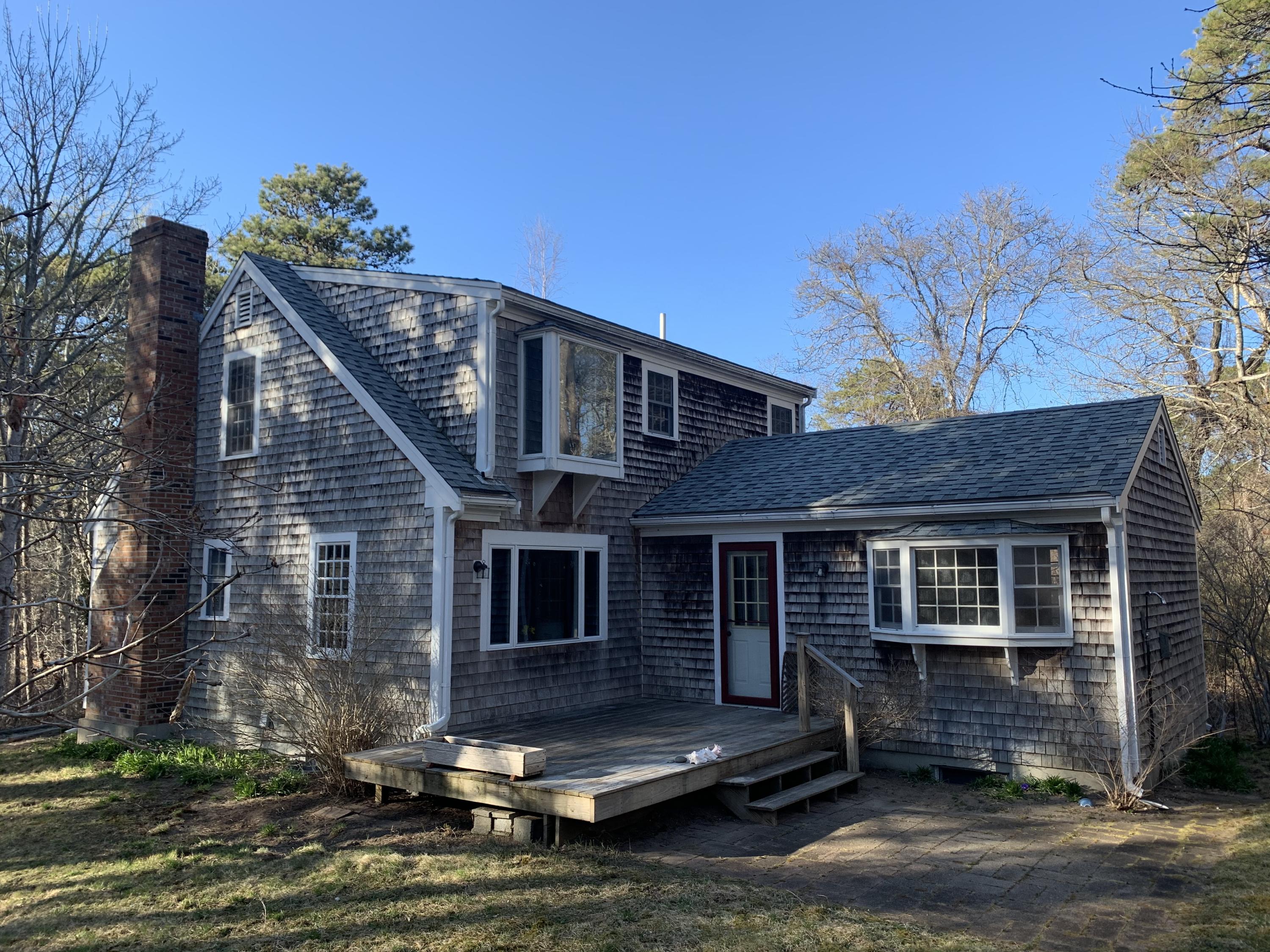 150 Browns Neck Road Wellfleet, MA 02667 - Photo 4 of 30 a view of a house with a yard