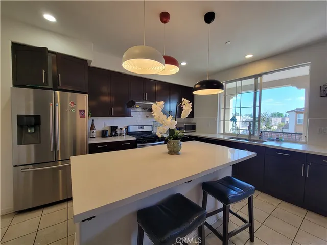 a kitchen with a sink cabinets and window