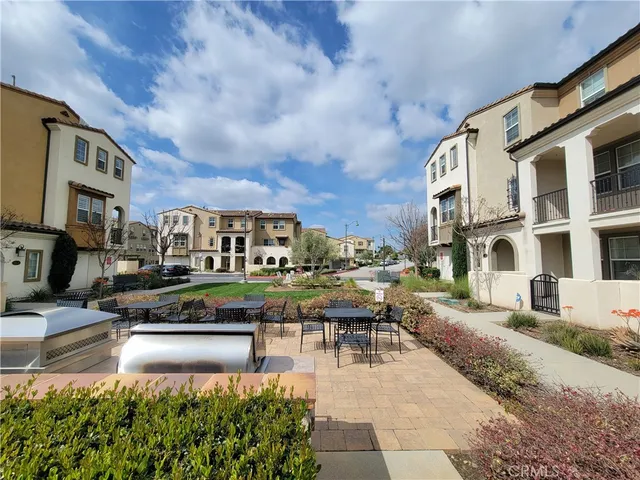 a swimming pool with outdoor seating and yard