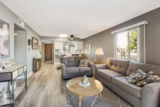 a living room with furniture and a large window