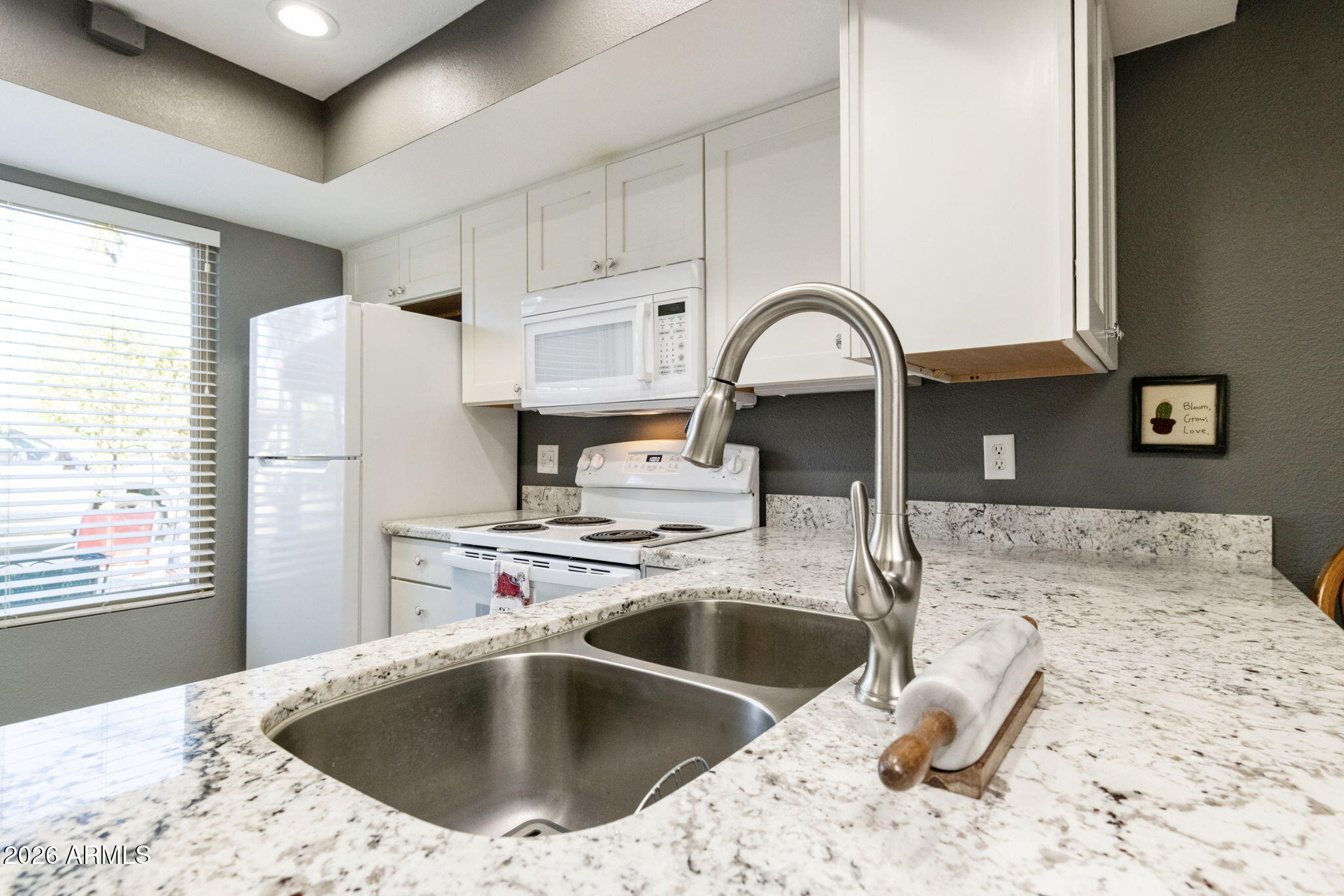 503 South Boojum Way Mesa, AZ 85208 - Photo 11 of 51 a kitchen with a sink a stove and refrigerator