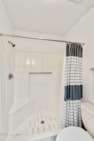 a bathroom with a bathtub and shower