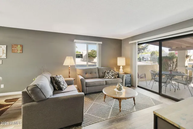 a living room with furniture and a large window
