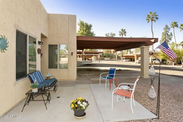 a view of pool table and chairs in patio