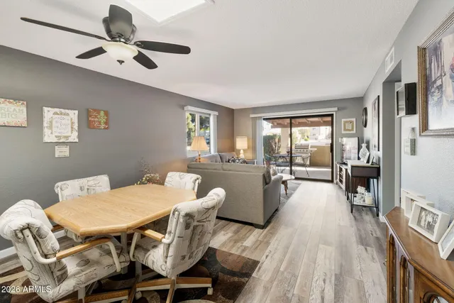 a view of a dining room with furniture window and wooden floor