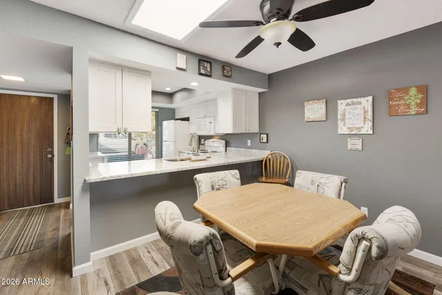a dining room with furniture and window