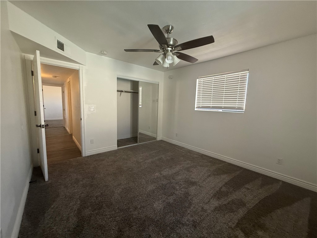 1645 Dunlap Road Fort Mohave, AZ 86426 - Photo 12 of 39 a view of a livingroom with a ceiling fan and window