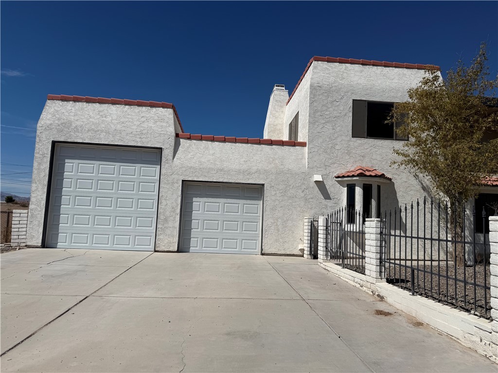 1645 Dunlap Road Fort Mohave, AZ 86426 - Photo 30 of 39 a front view of a house with a garage