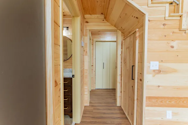 a bathroom with a granite countertop sink a toilet and a mirror