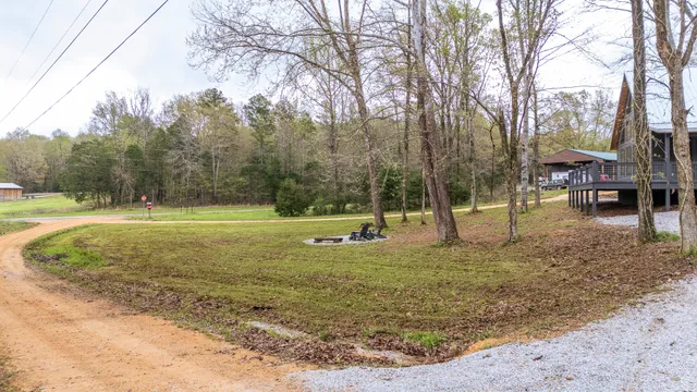 a view of a porch with wooden floor and door