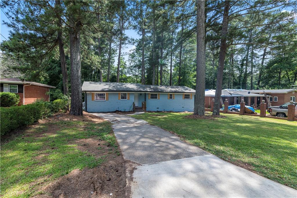 3341 Jackson Drive Decatur, GA 30032 - Photo 1 of 1 a view of a house with backyard and a garden