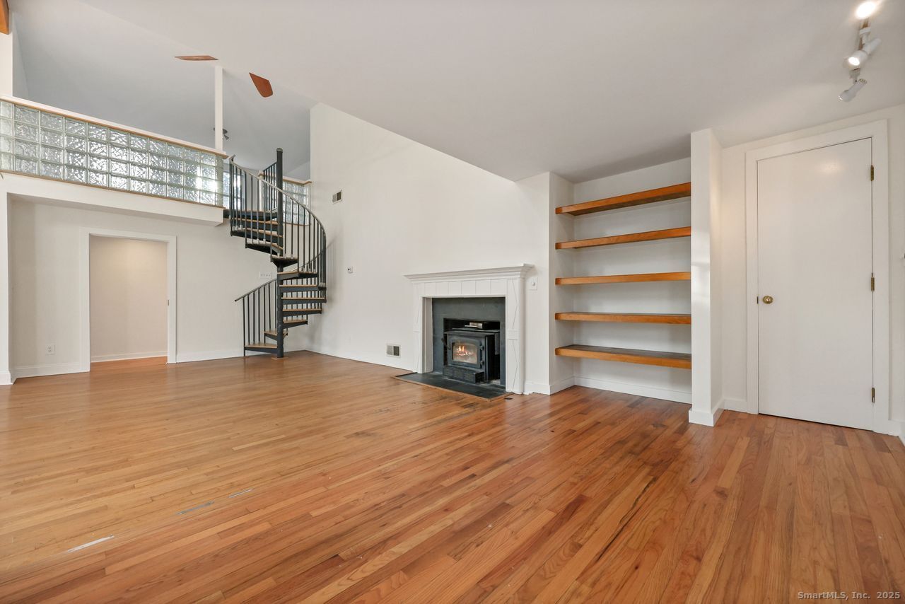 38 Chester Road Easton, CT 06612 - Photo 12 of 36 a view of empty room with wooden floor and fireplace