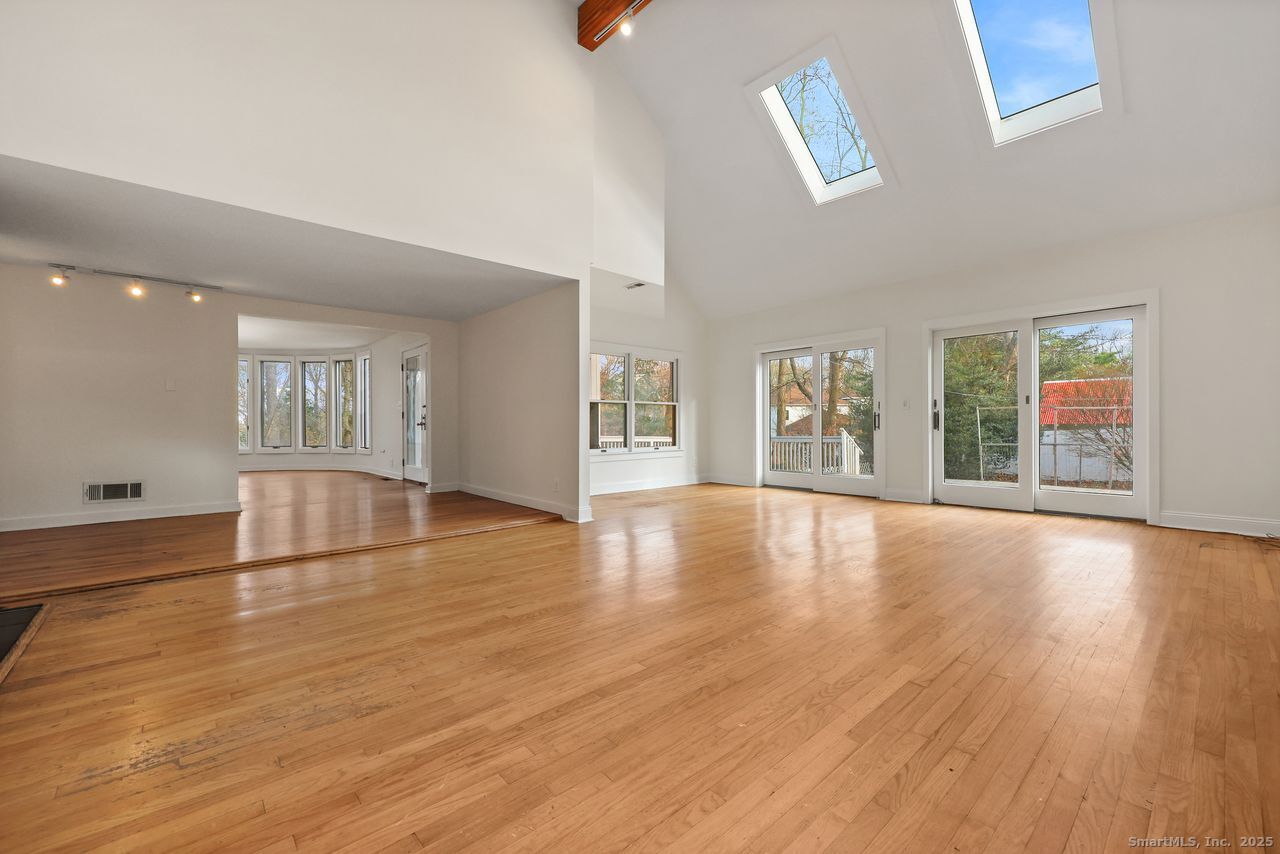 38 Chester Road Easton, CT 06612 - Photo 13 of 36 a view of an empty room with window and wooden floor