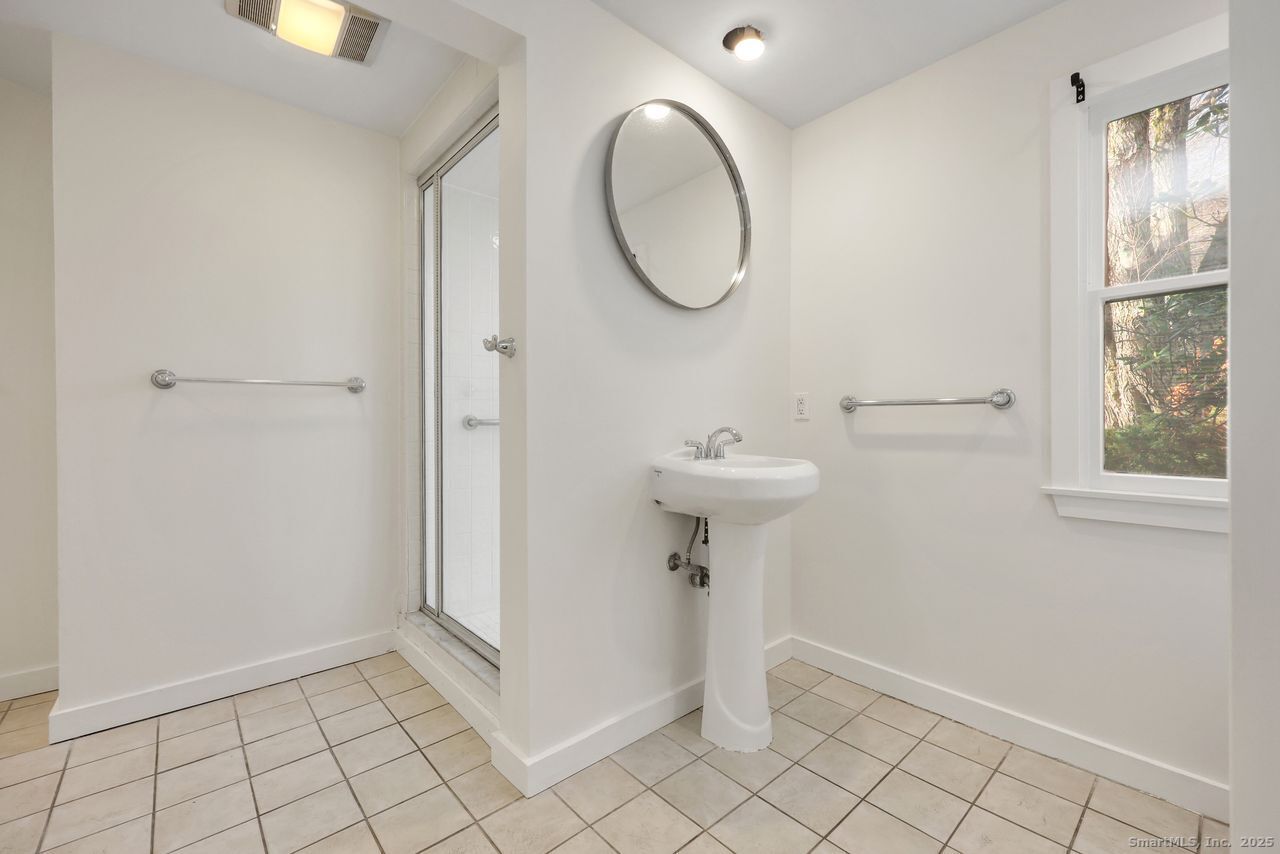 38 Chester Road Easton, CT 06612 - Photo 22 of 36 a bathroom with a sink toilet and shower