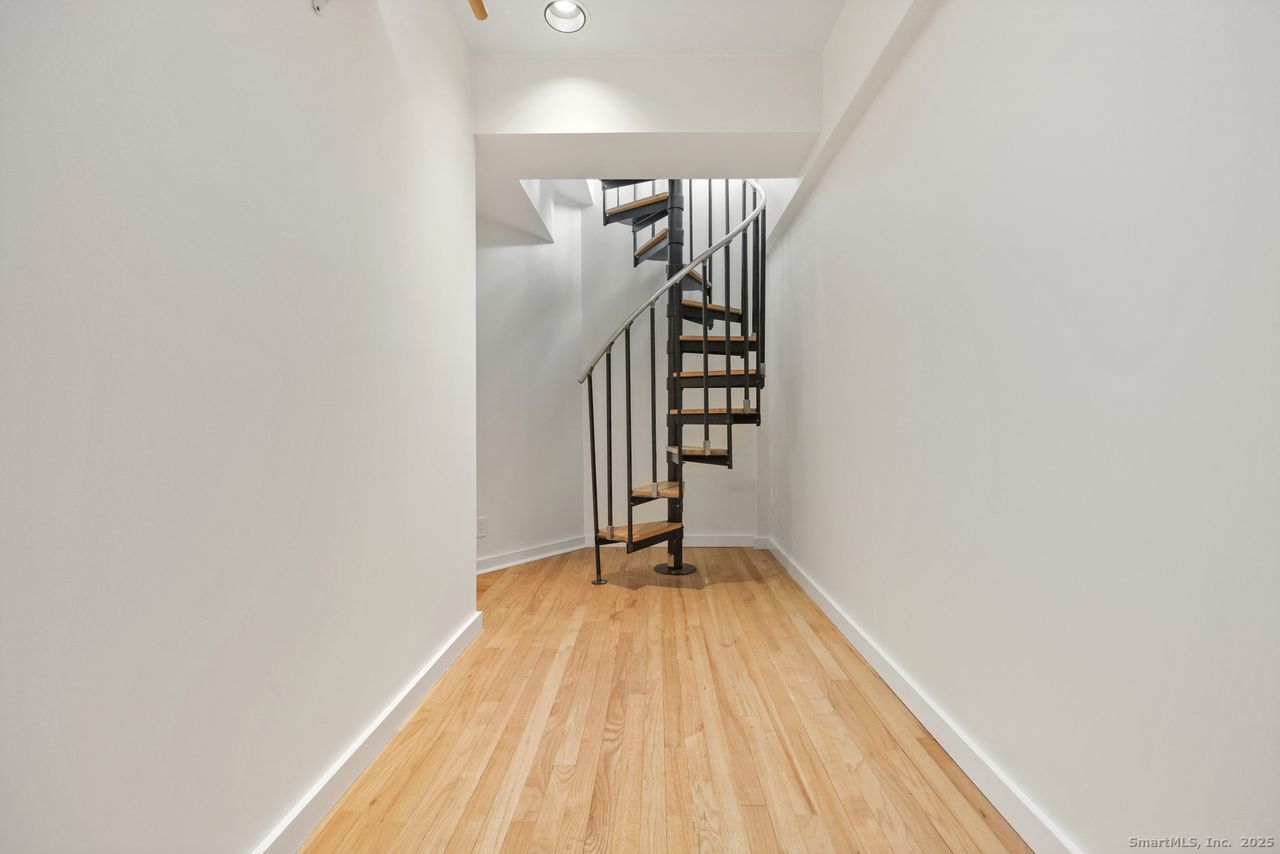 38 Chester Road Easton, CT 06612 - Photo 31 of 36 a view of a room with wooden floor and stairs