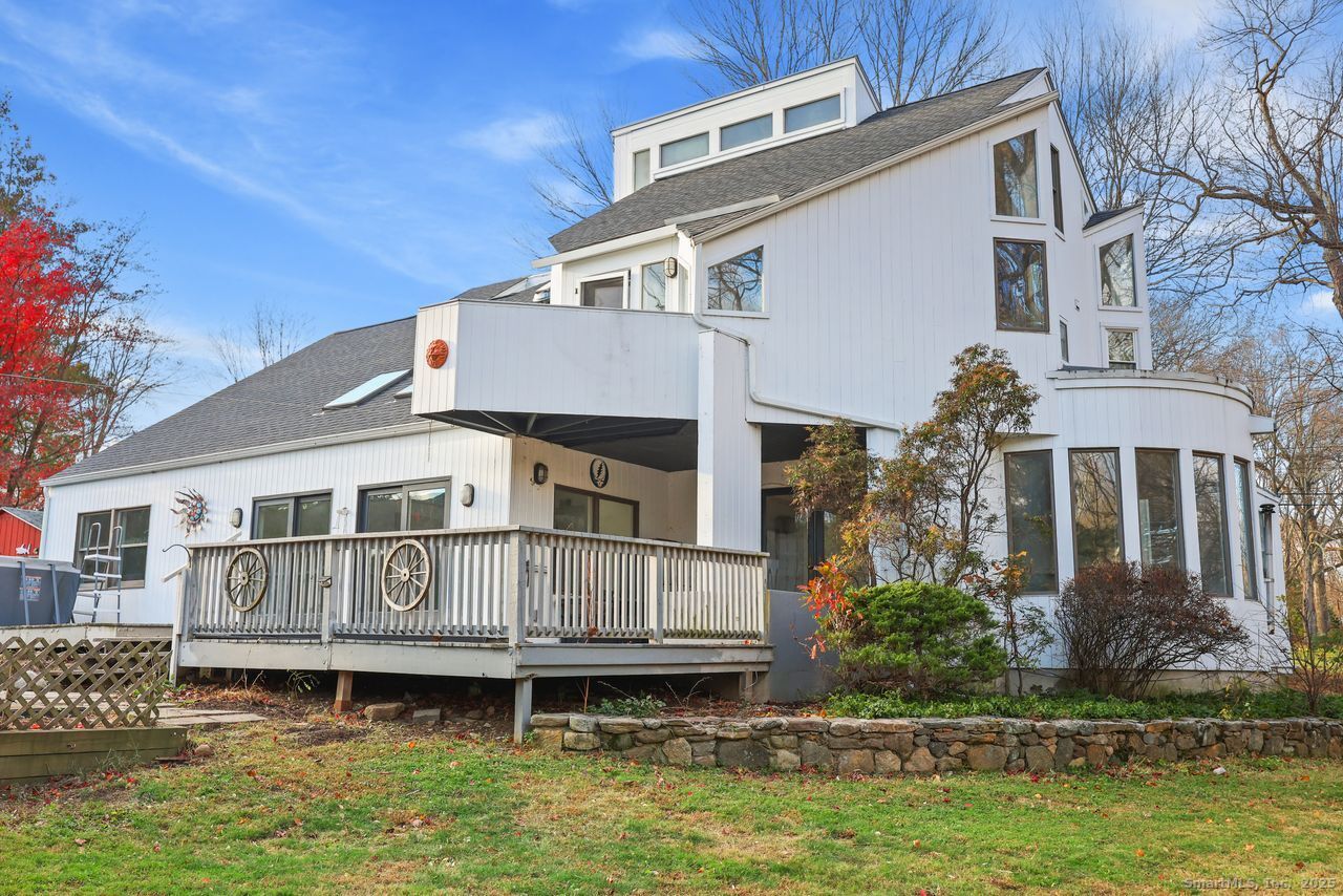 38 Chester Road Easton, CT 06612 - Photo 33 of 36 a front view of a house with a small yard and a large tree in it