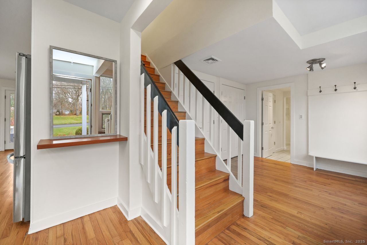 38 Chester Road Easton, CT 06612 - Photo 5 of 36 a view of entryway and hall with wooden floor
