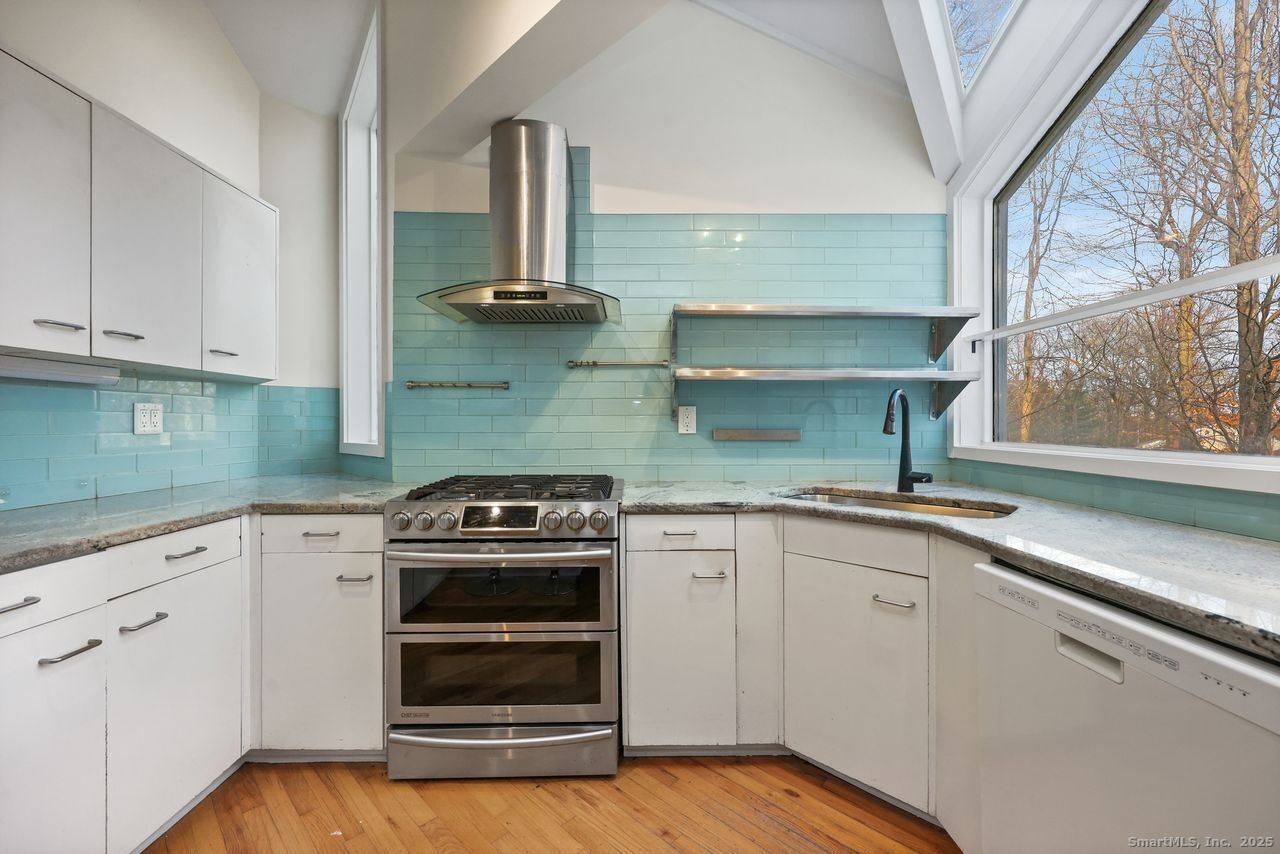 38 Chester Road Easton, CT 06612 - Photo 8 of 36 a kitchen with a stove and a sink