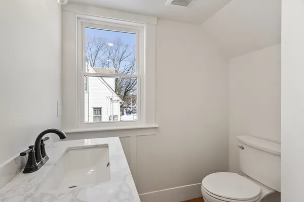a bathroom with a toilet and a sink