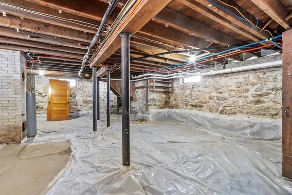 a view of under construction room and a car parked