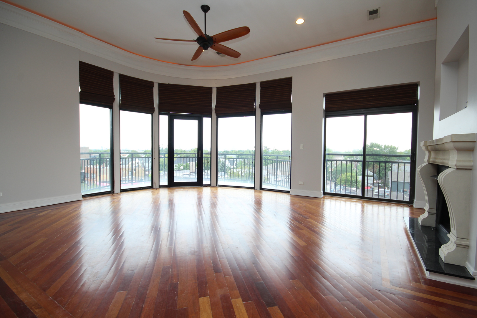 2954 West Irving Park Road, Unit 4C Chicago, IL 60618 - Photo 3 of 44 a view of empty room with wooden floor and fan