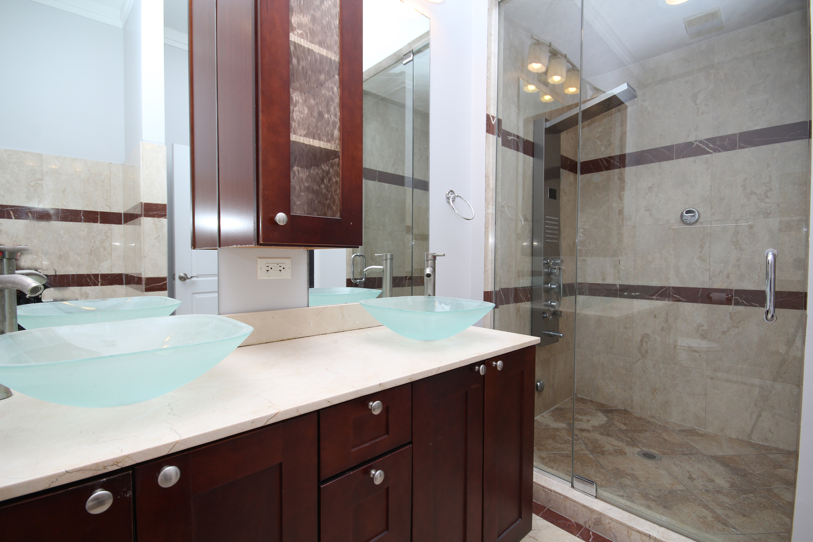 2954 West Irving Park Road, Unit 4C Chicago, IL 60618 - Photo 7 of 44 a bathroom with a sink and a mirror