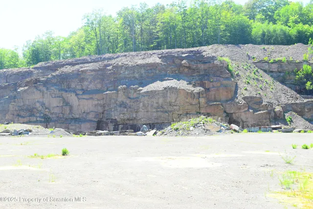 a view of wooden fence in front of a house