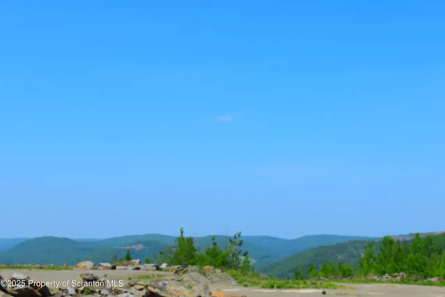 a view of a beach with a outdoor space