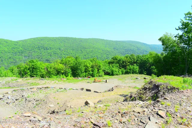 a view of a lake with beach