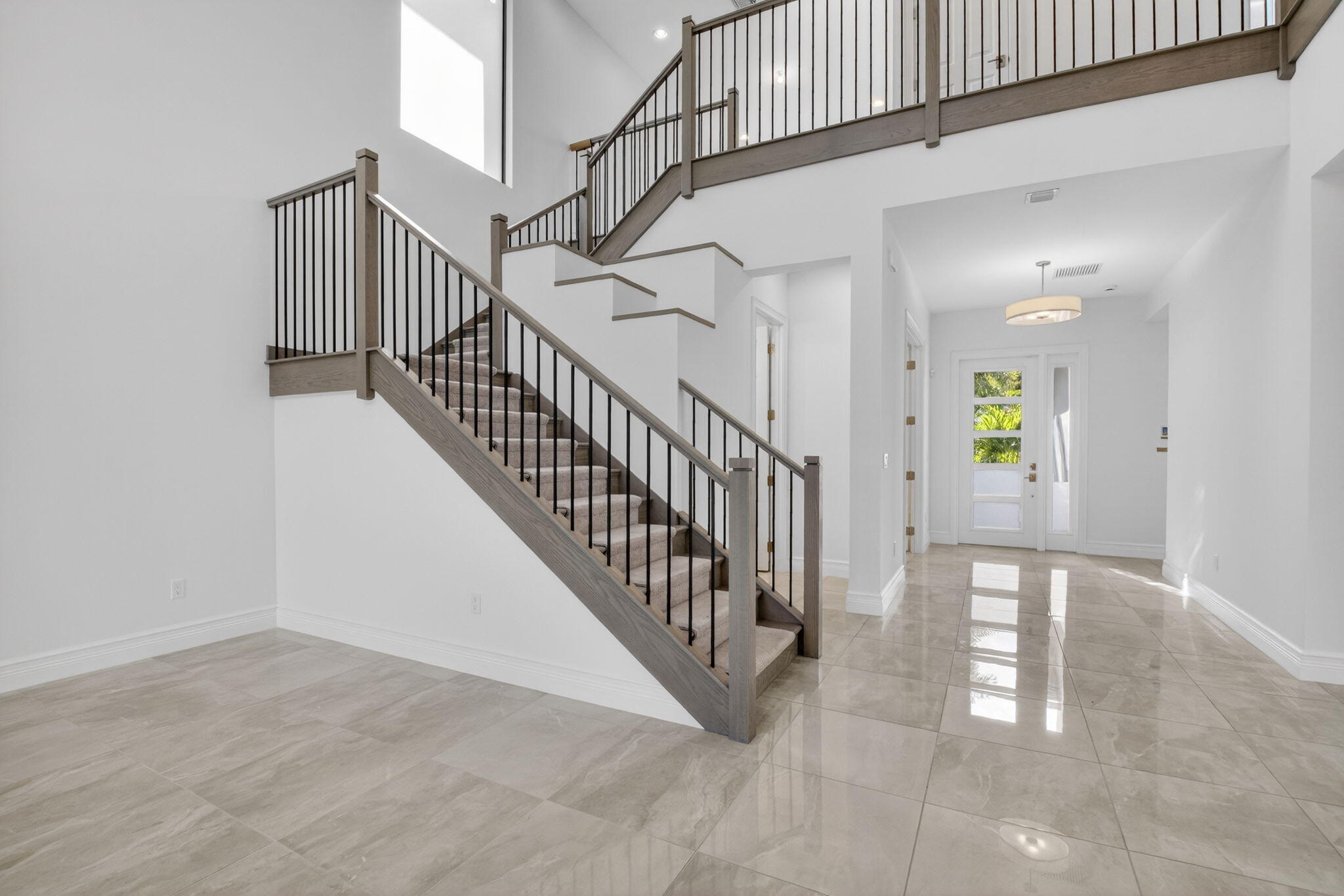 9087 Chauvet Way Boca Raton, FL 33496 - Photo 12 of 78 a view of an entryway with wooden floor
