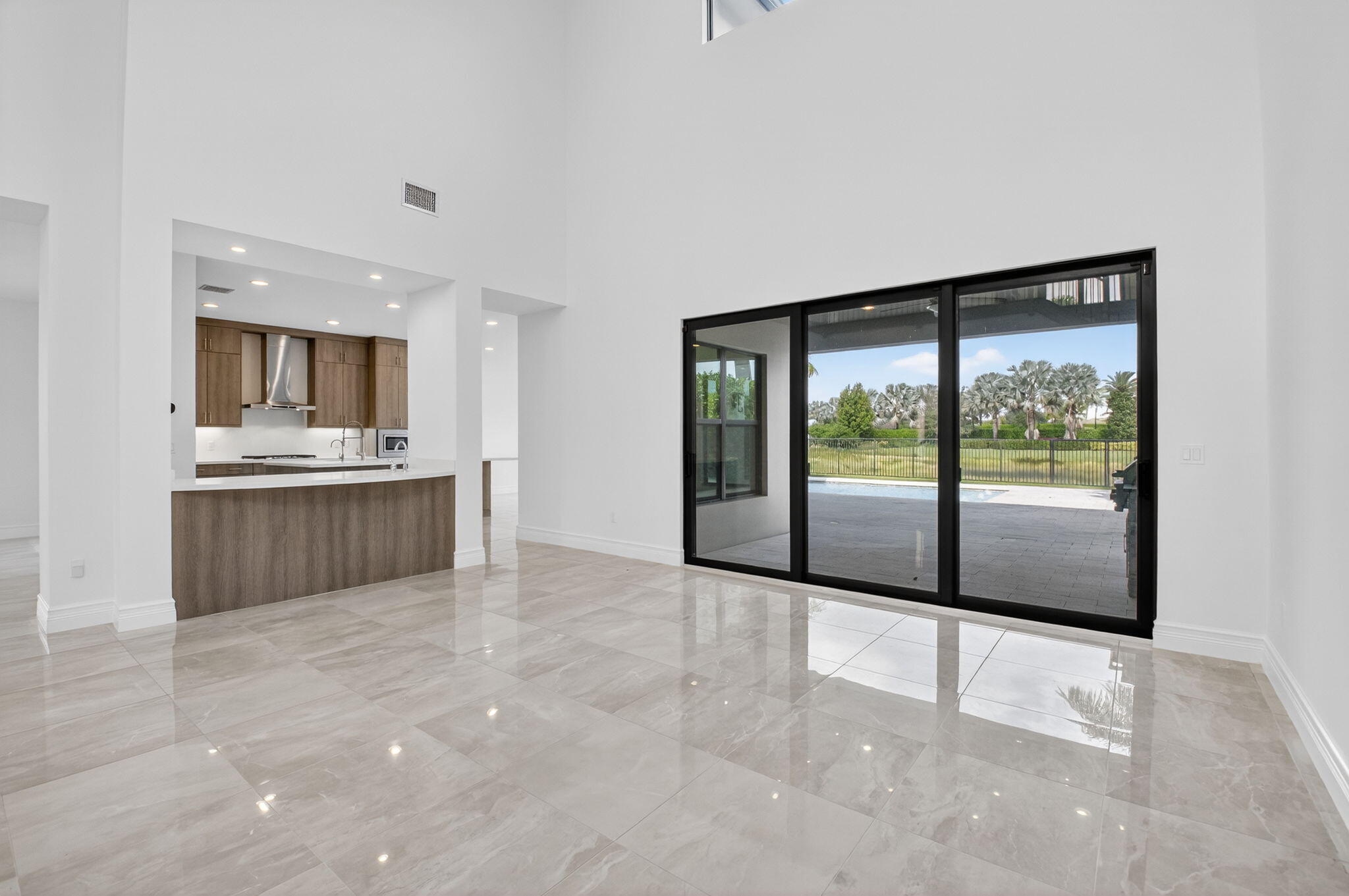 9087 Chauvet Way Boca Raton, FL 33496 - Photo 17 of 78 a view of a kitchen with large windows