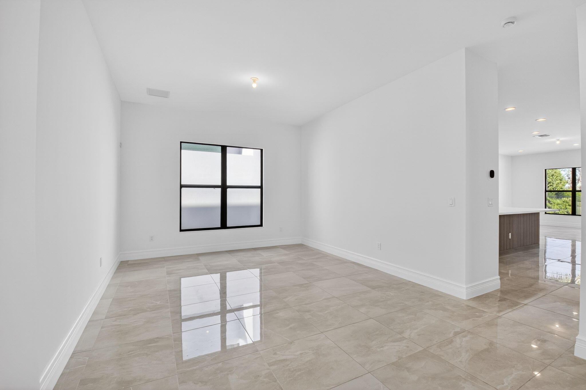 9087 Chauvet Way Boca Raton, FL 33496 - Photo 19 of 78 an empty room with windows and cabinet