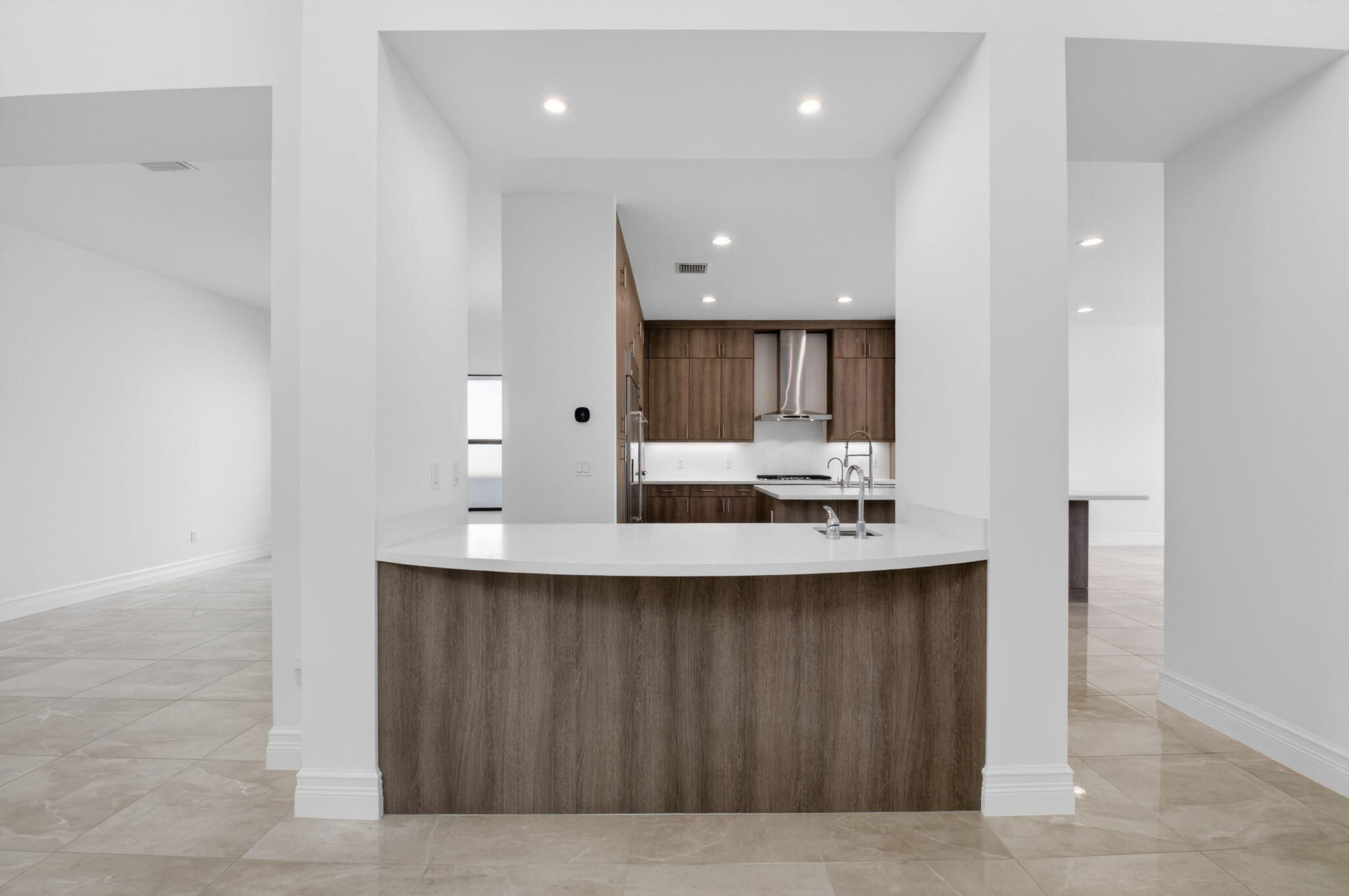 9087 Chauvet Way Boca Raton, FL 33496 - Photo 20 of 78 a kitchen with kitchen island a sink stainless steel appliances and cabinets