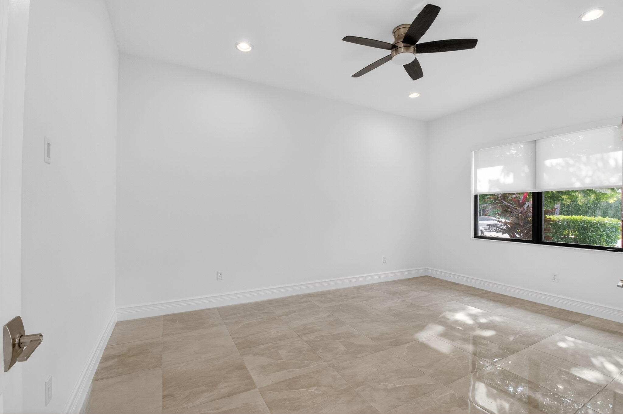 9087 Chauvet Way Boca Raton, FL 33496 - Photo 33 of 78 an empty room with a ceiling fan and window