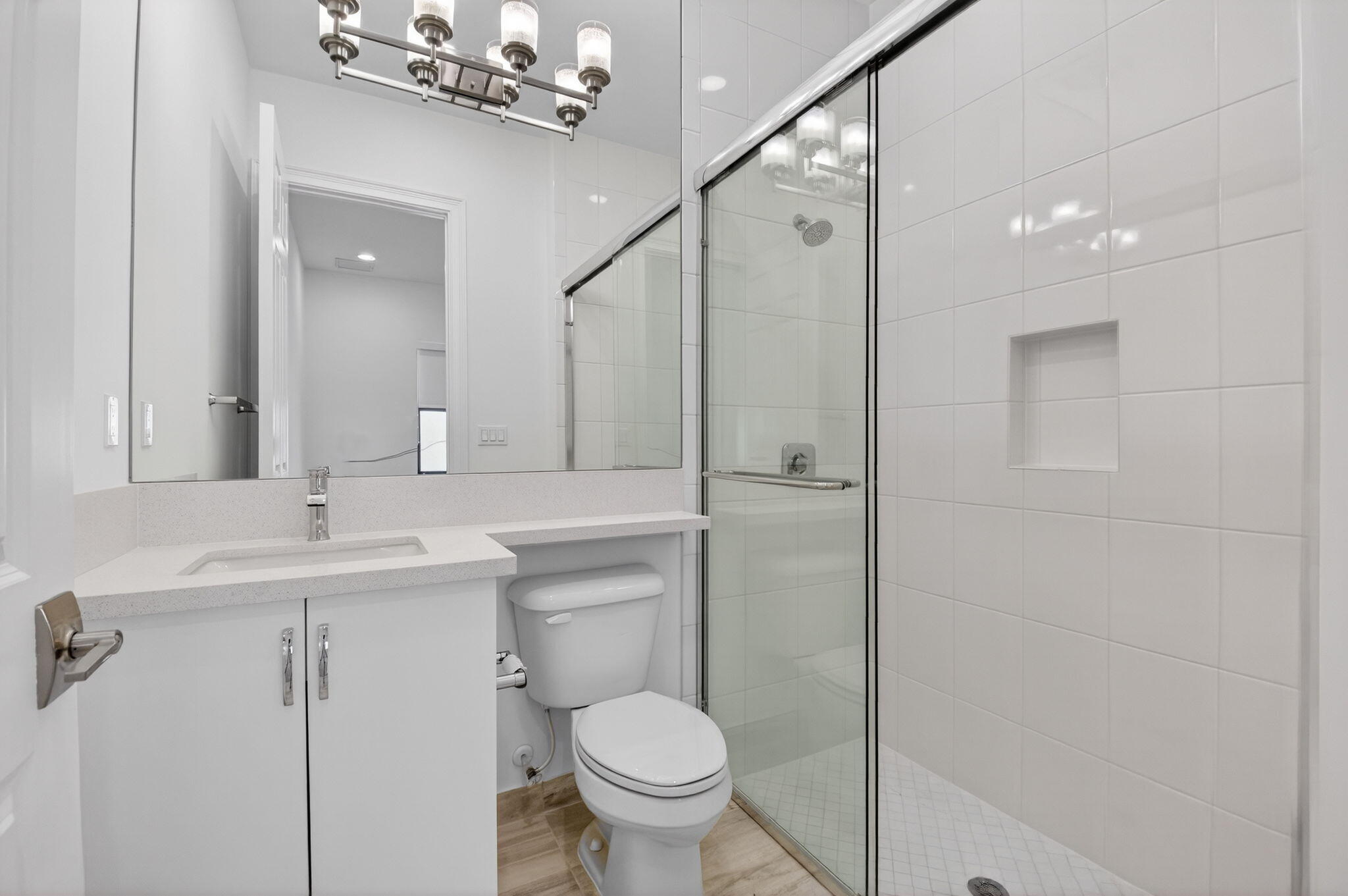 9087 Chauvet Way Boca Raton, FL 33496 - Photo 36 of 78 a bathroom with a toilet sink and mirror