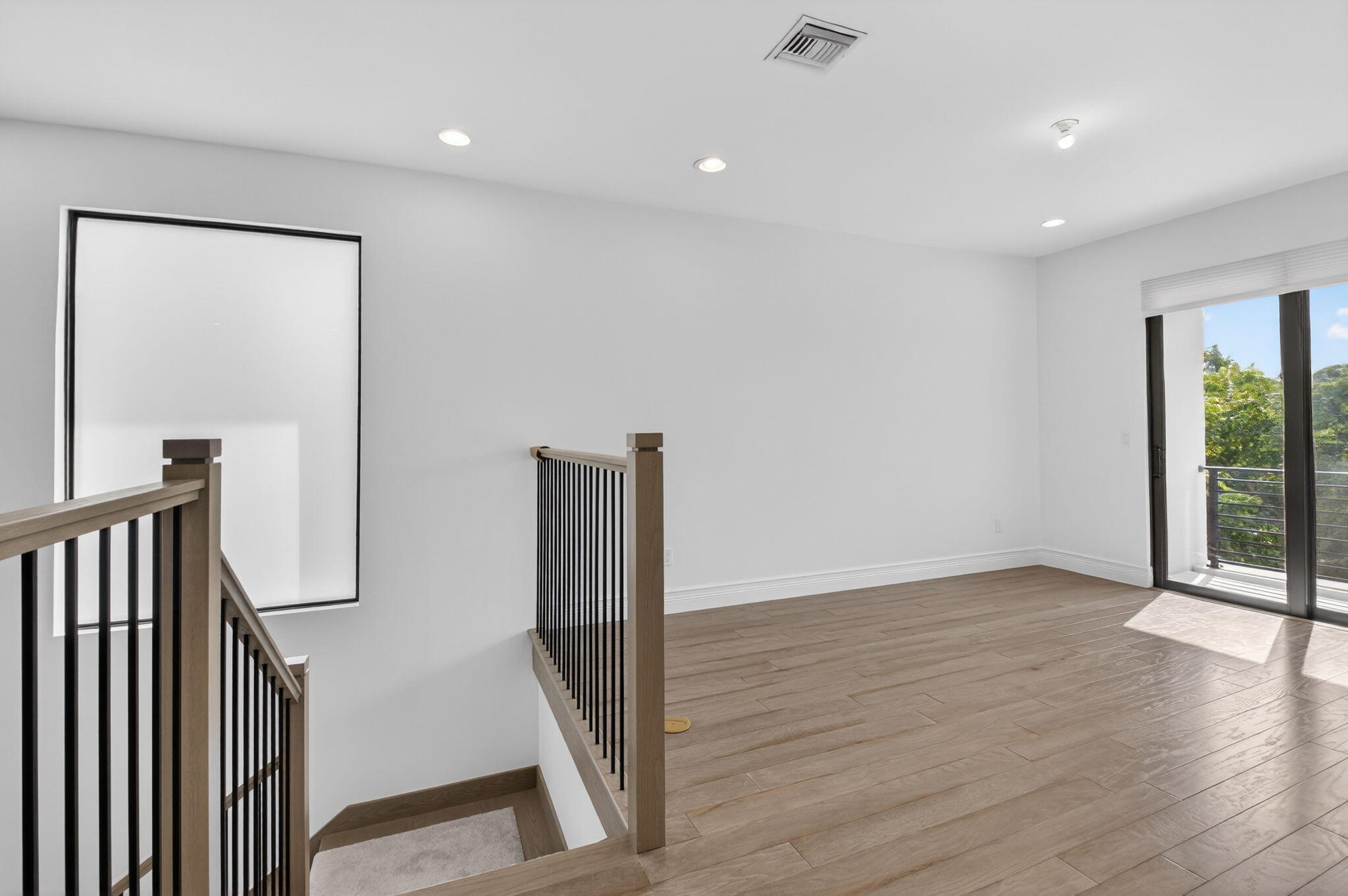 9087 Chauvet Way Boca Raton, FL 33496 - Photo 37 of 78 a view of a hallway with wooden floor and staircase