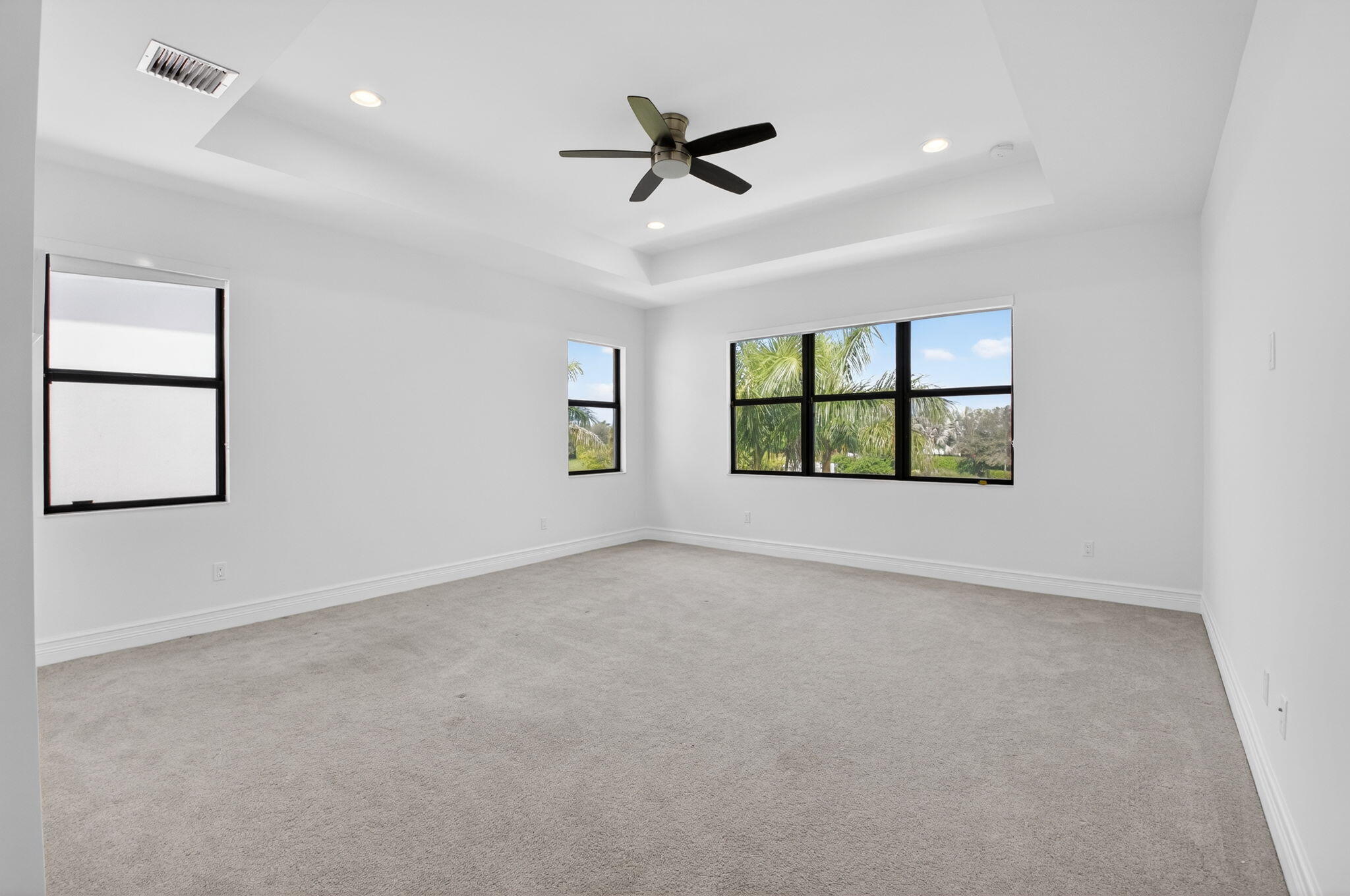 9087 Chauvet Way Boca Raton, FL 33496 - Photo 39 of 78 an empty room with windows and ceiling fan
