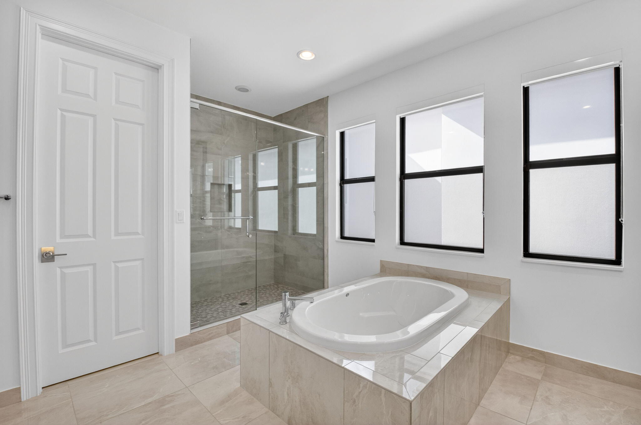 9087 Chauvet Way Boca Raton, FL 33496 - Photo 45 of 78 a bathroom with a sink a bathtub and next to a window