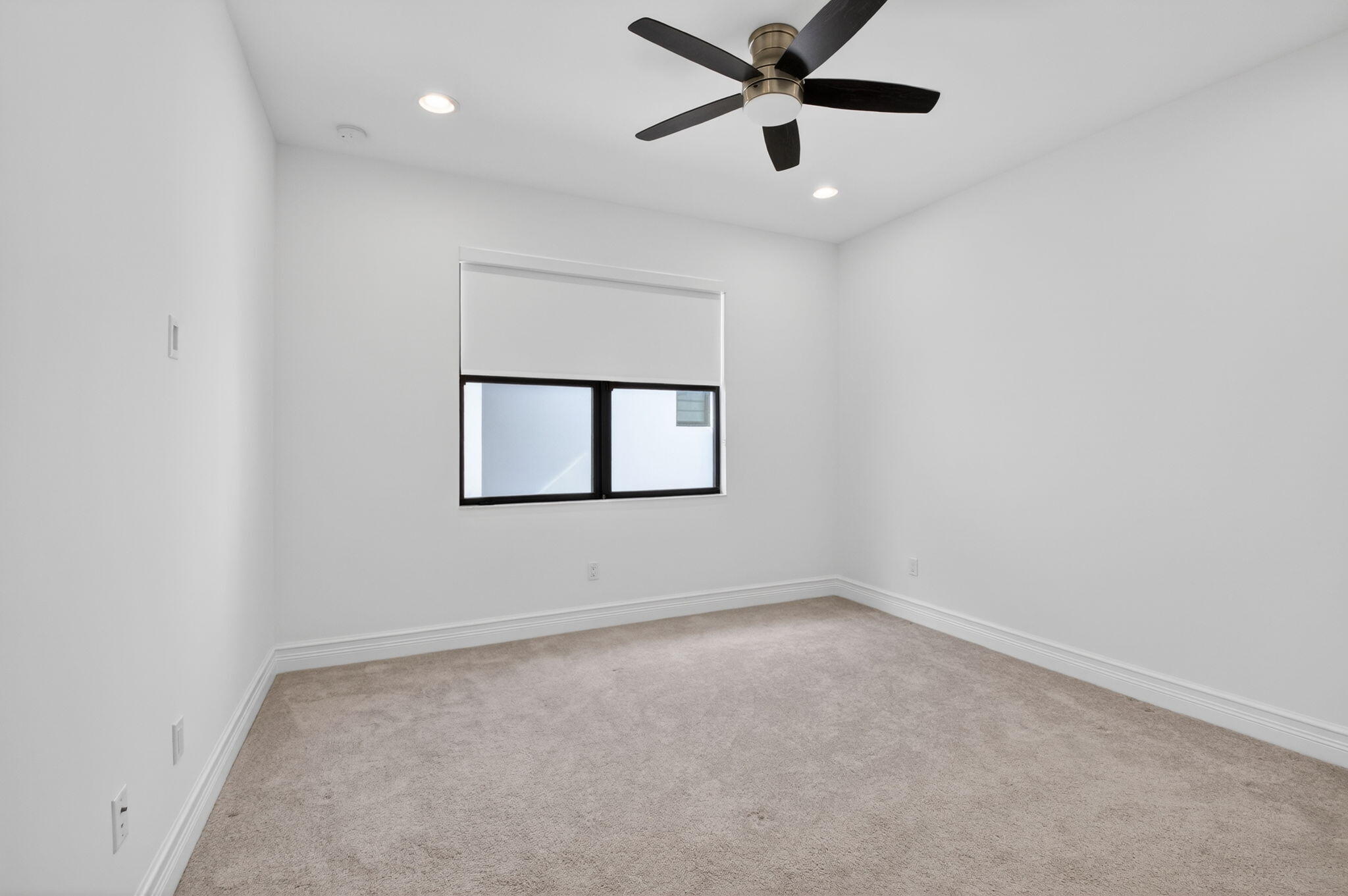 9087 Chauvet Way Boca Raton, FL 33496 - Photo 46 of 78 an empty room with a window and a fan