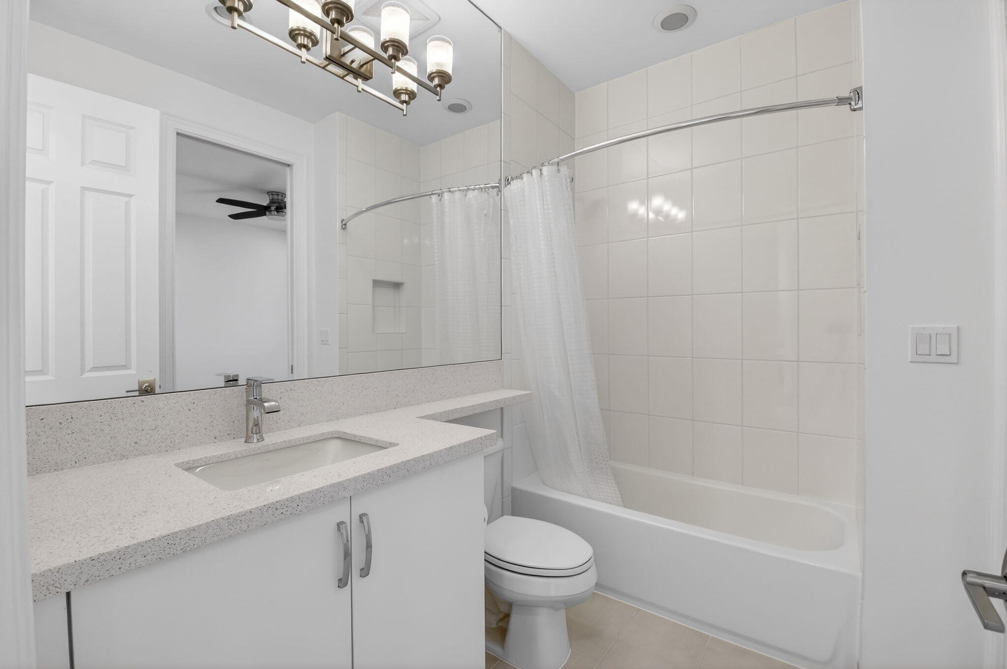 9087 Chauvet Way Boca Raton, FL 33496 - Photo 48 of 78 a bathroom with a sink a toilet a mirror and shower