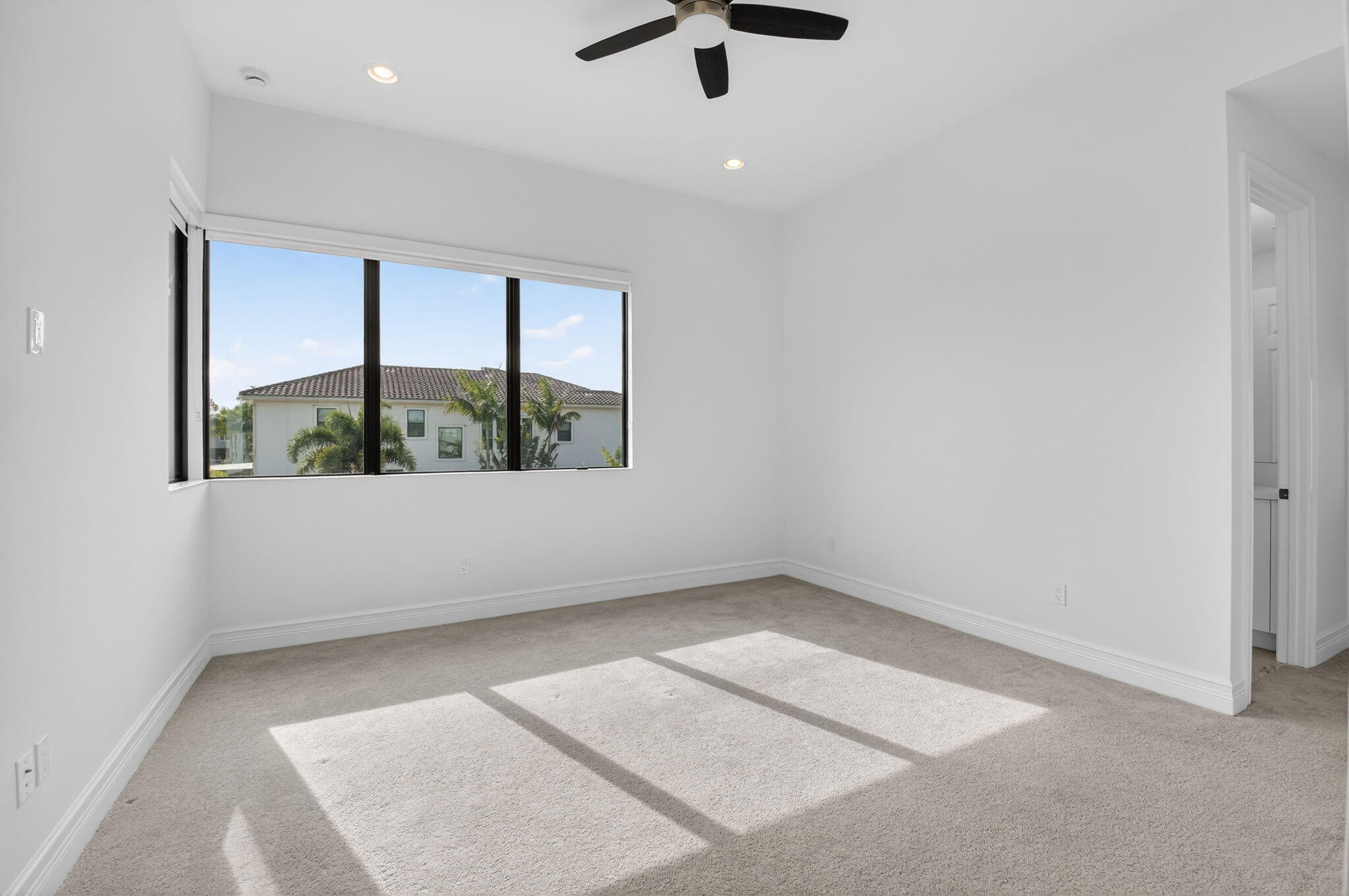 9087 Chauvet Way Boca Raton, FL 33496 - Photo 49 of 78 an empty room with windows