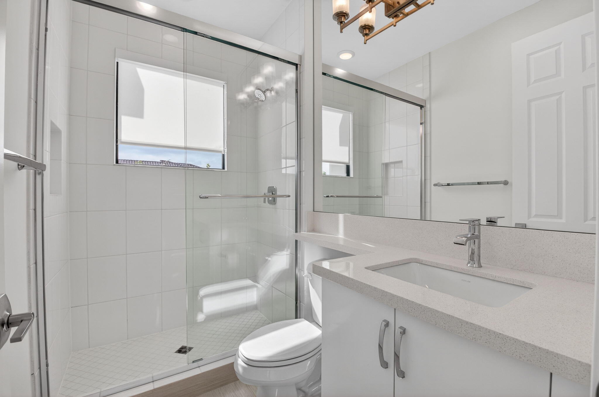 9087 Chauvet Way Boca Raton, FL 33496 - Photo 50 of 78 a bathroom with a sink a toilet and shower