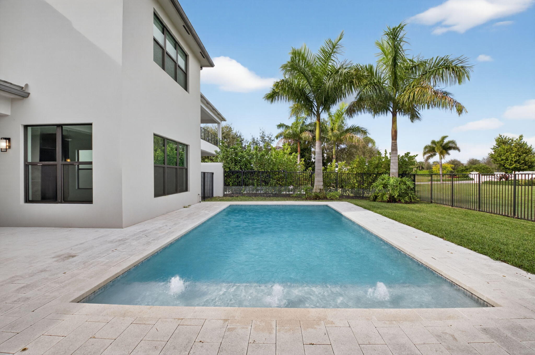 9087 Chauvet Way Boca Raton, FL 33496 - Photo 57 of 78 a view of a backyard with palm trees