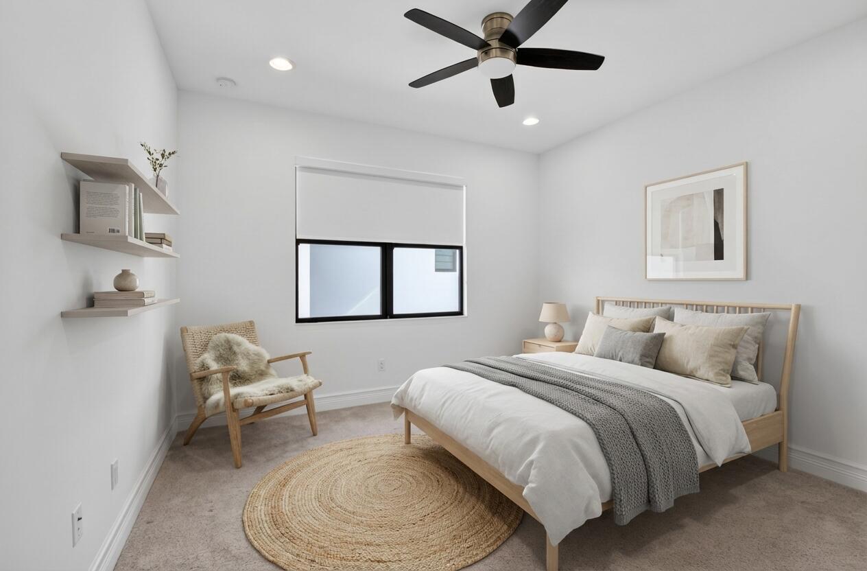 9087 Chauvet Way Boca Raton, FL 33496 - Photo 9 of 78 a bedroom with a bed and a chair