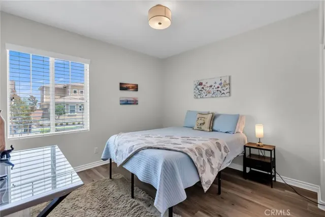 a front view of a house with swimming pool and furniture