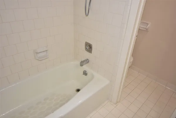 a bathroom with a sink and cabinets