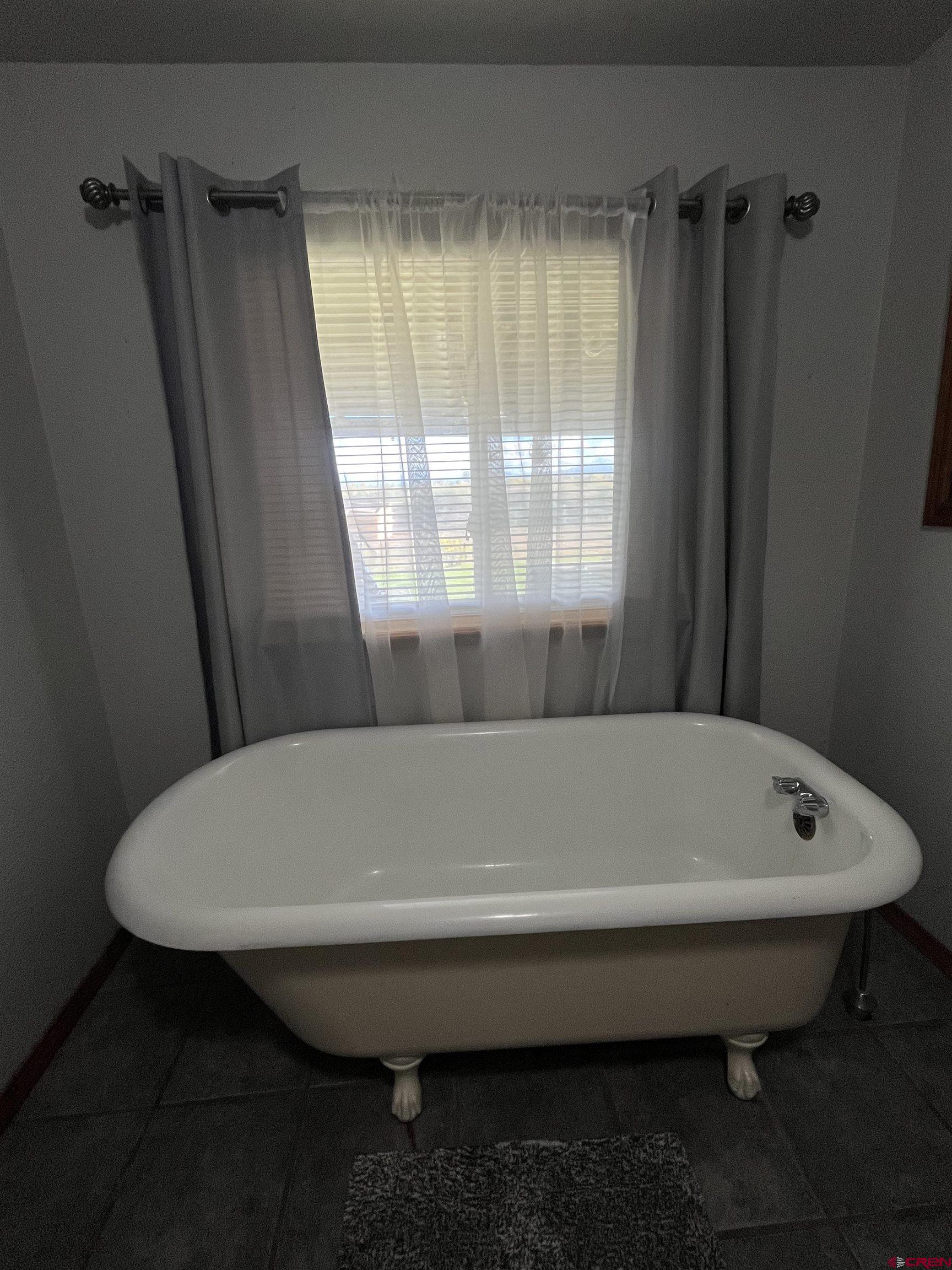 16400 6630 Road Montrose, CO 81401 - Photo 18 of 27 a bathroom with a sink and bathtub