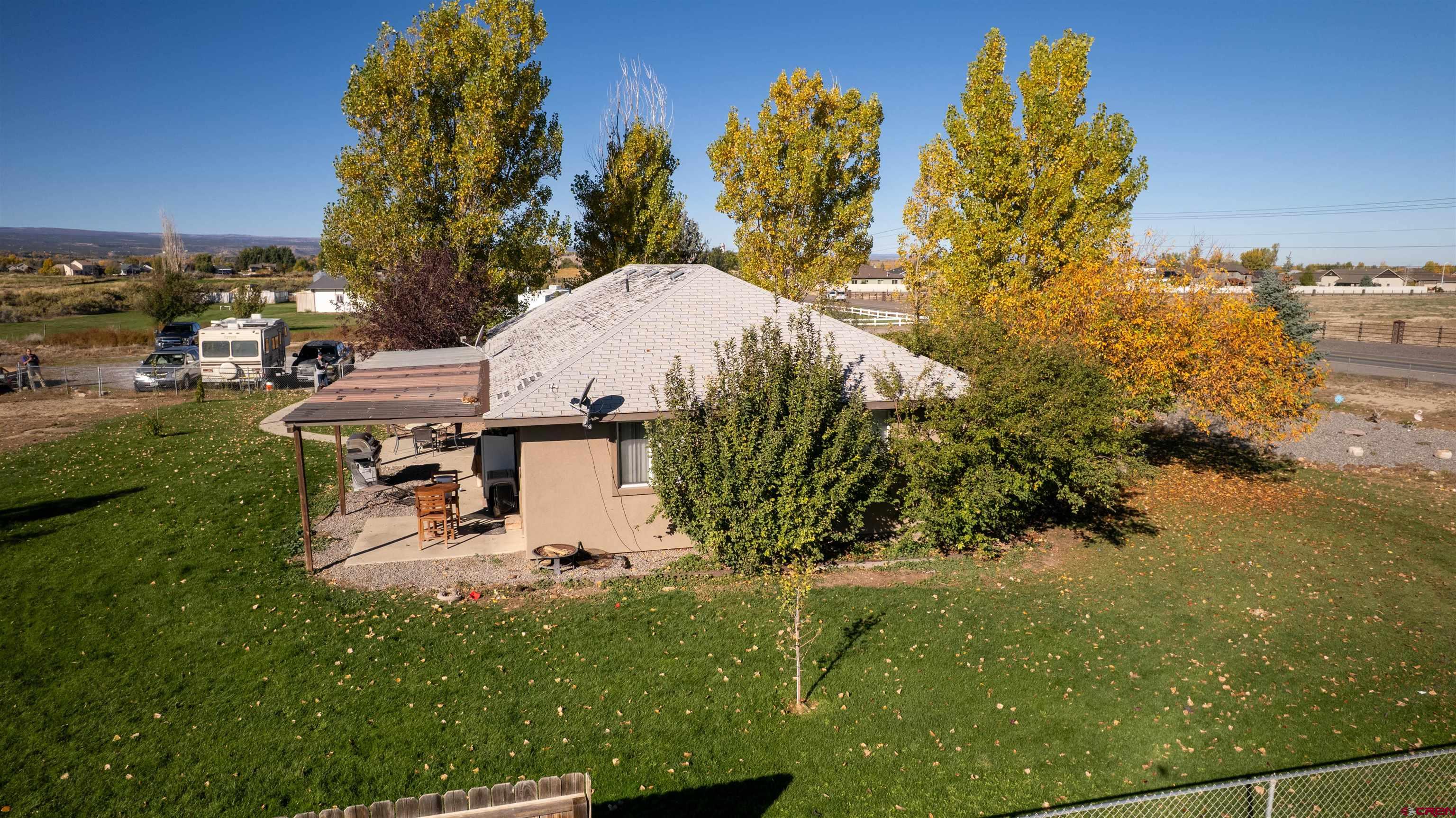 16400 6630 Road Montrose, CO 81401 - Photo 27 of 27 a view of a lake with a building in the background
